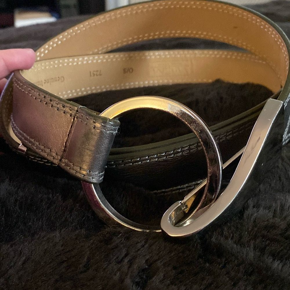 Metallic gray belt.  Adjustable up to 40”